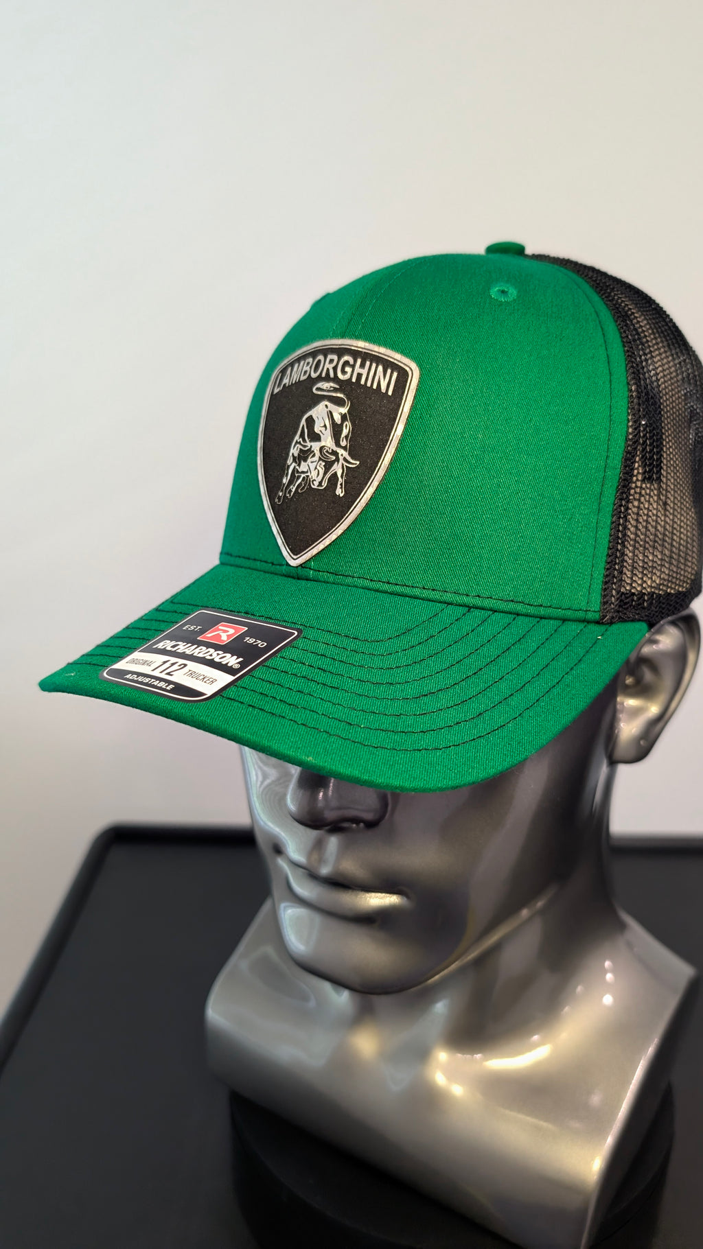Handmade laser engraved silver carbon fiber leather patch hat inspired by the aggressive style of Italian supercars.