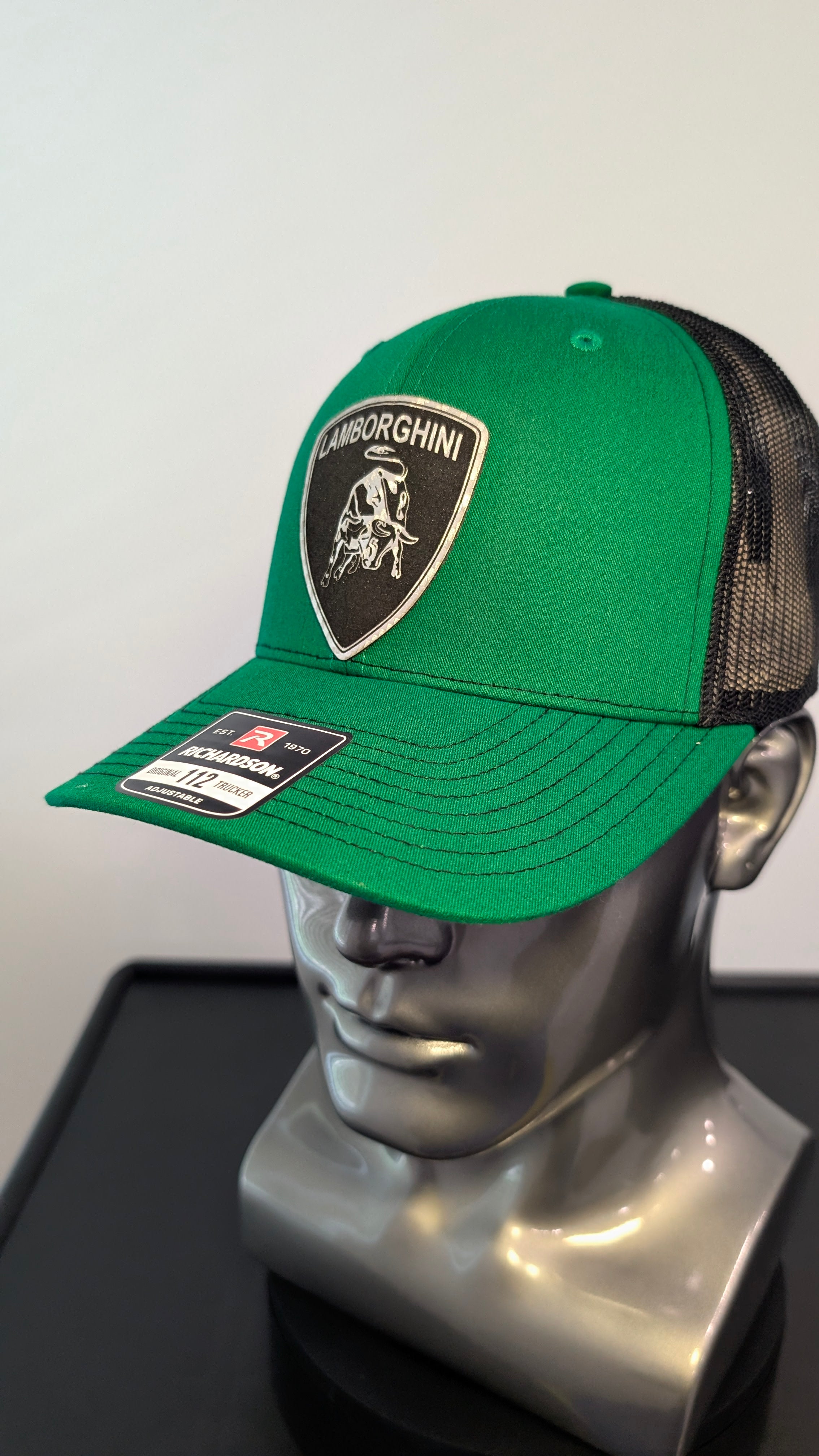 Handmade laser engraved silver carbon fiber leather patch hat inspired by the aggressive style of Italian supercars.